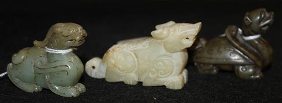 Two Chinese carved brown/grey jade models of kylin & a similar pale hardstone carving